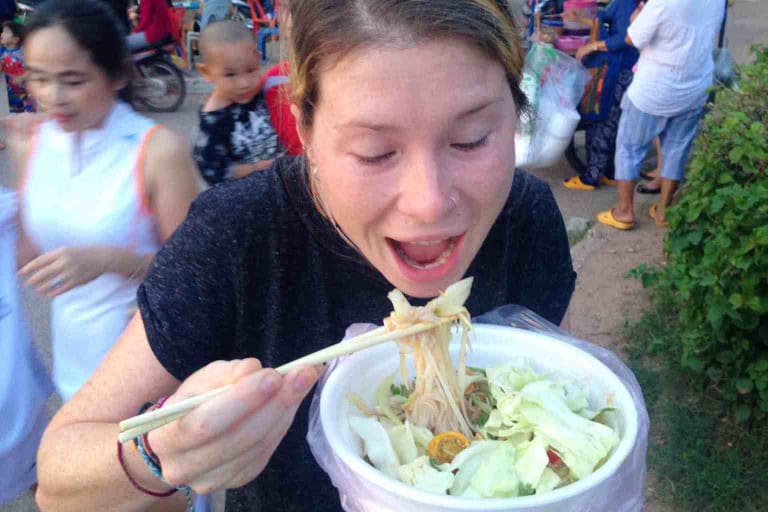 Sarah eating street food in Laos