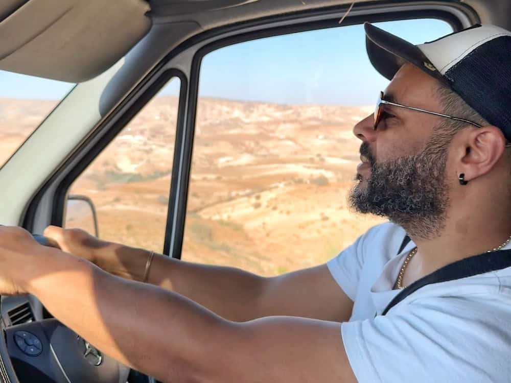 Driving campervan through desert terrain
