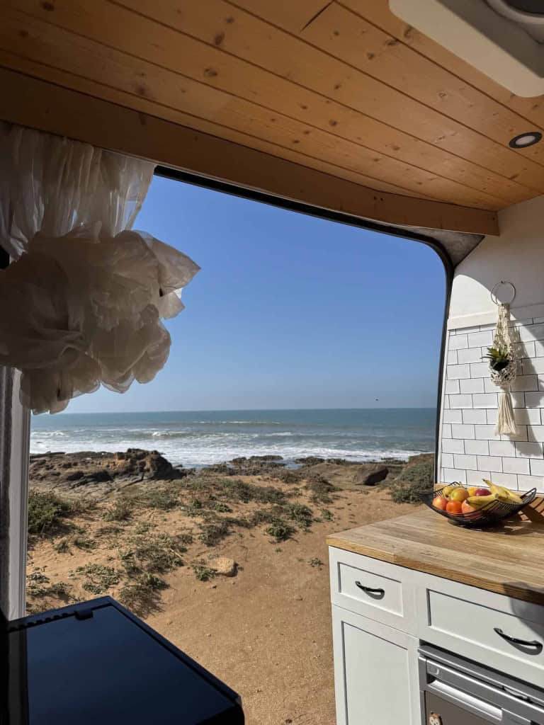 View of beach from campervan door