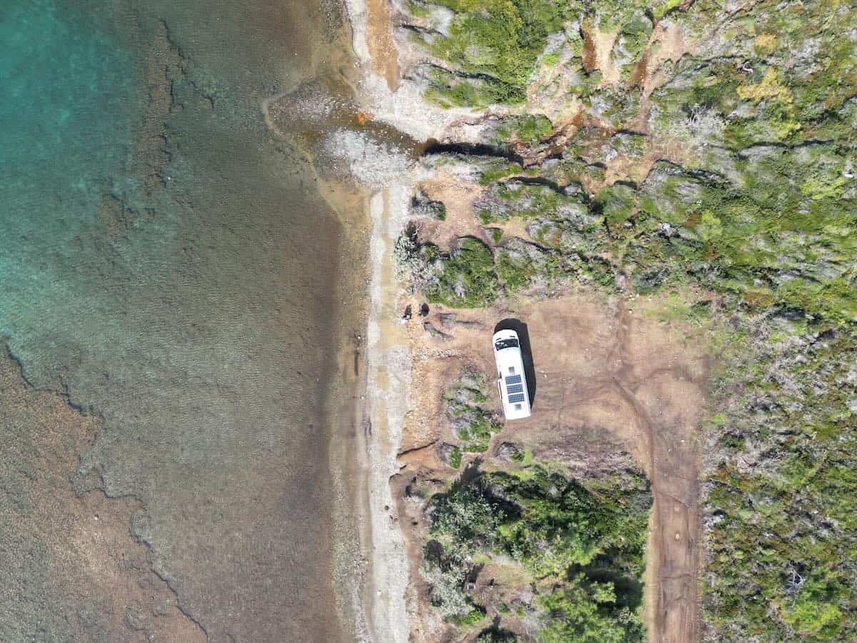 aerial view of campervan on a beach